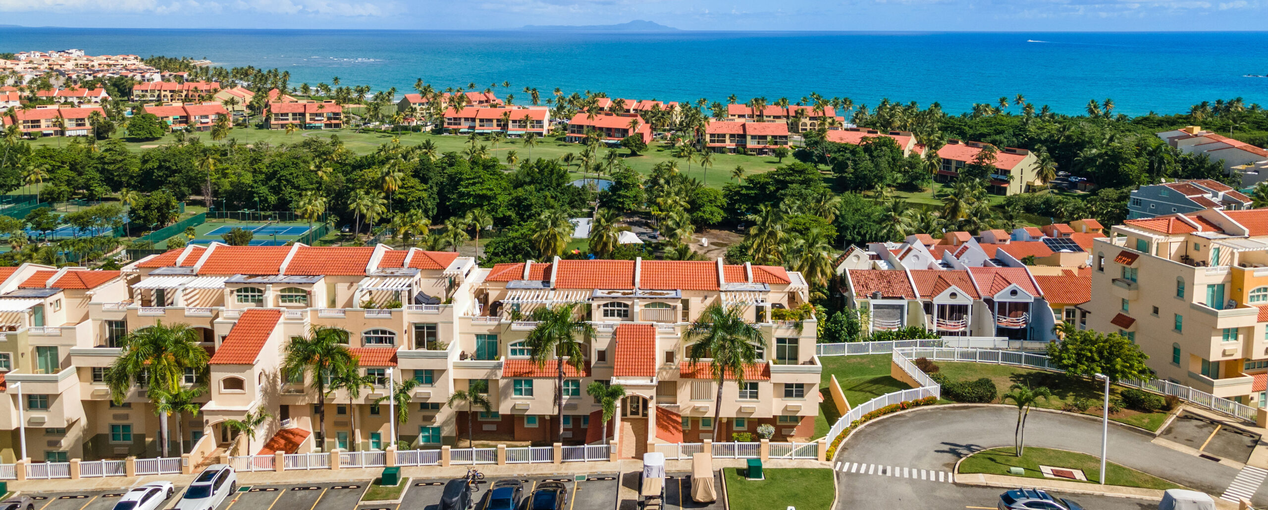 Aerial view of homes in Palmas del Mar built under the PHA-ARB construction regulations, showing the community's Mediterranean and Caribbean architectural style