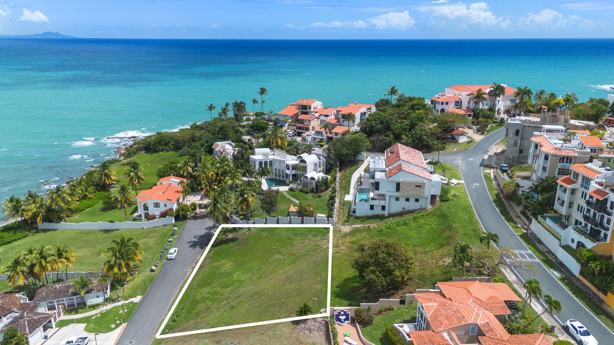 Aerial view of a lot for sale in Palmas del Mar with property boundary marked
